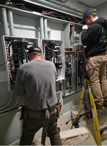 Technicians installing and servicing a commercial battery energy storage system in Albany, NY.